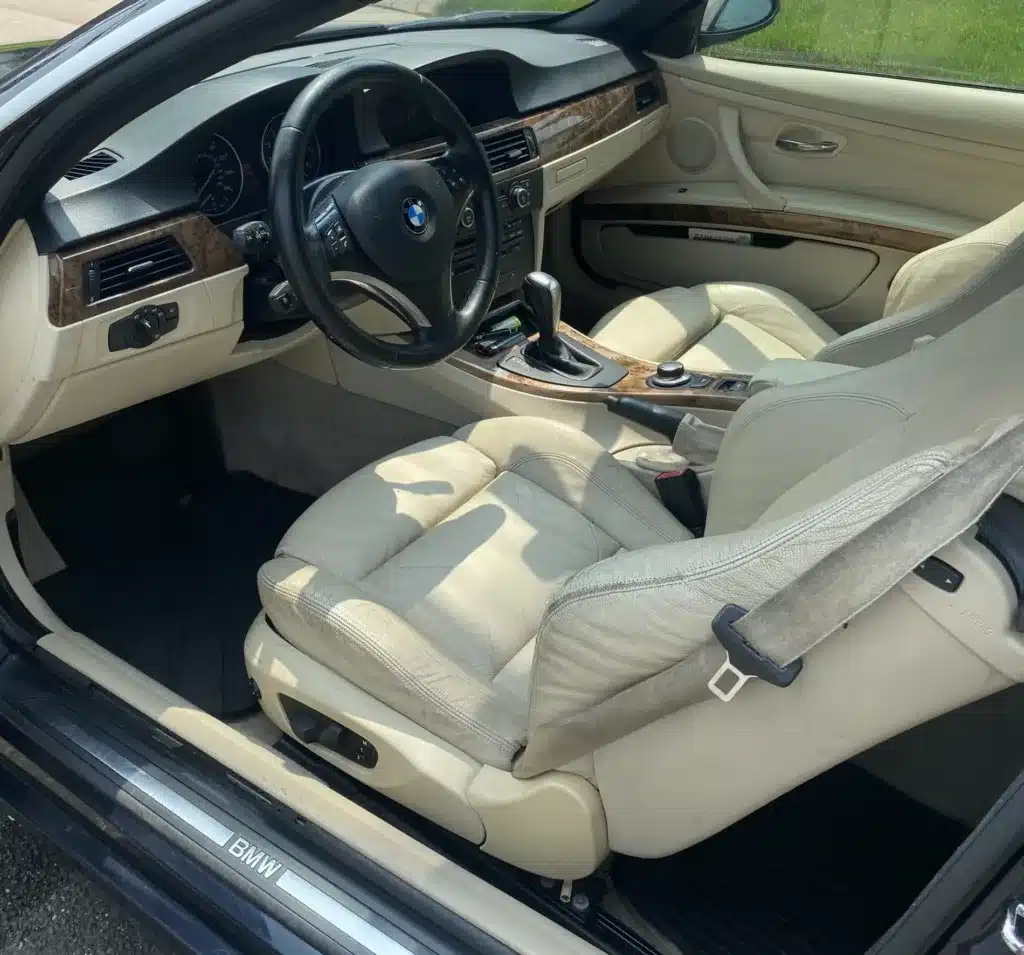 steam cleaning the leather seats and panels in a car removing the built up cigarette residue