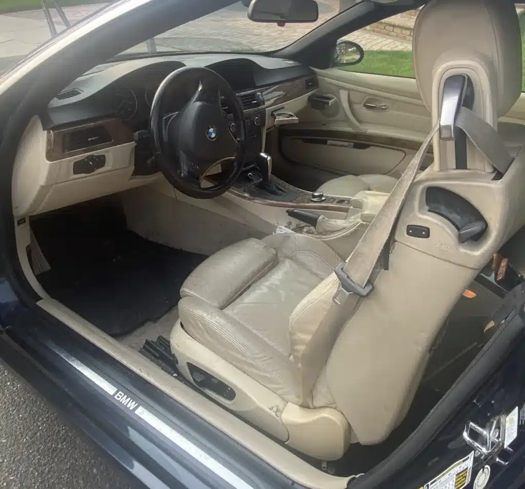 steam cleaning the leather seats and panels in a car removing the built up cigarette residue